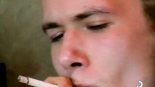 Hot dude stroking his huge dick and enjoys smoking butts