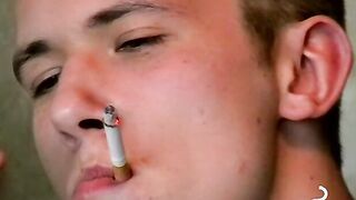 Hot dude stroking his huge dick and enjoys smoking butts