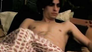Handsome looking twink strokes his big dick on webcam solo