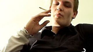 Tomy cant help rubbing his throbbing cock while smoking