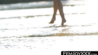 At the beach a cunning lady strips off to tease