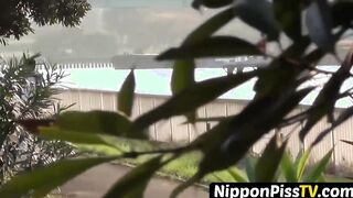 Entrancing Japanese young lady peeing rapidly outside during day