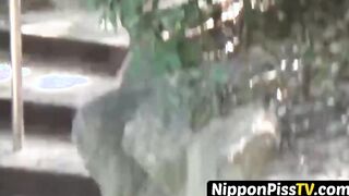 Japanese brunette squats while pissing outside