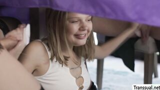 Sneaky teen Coco sucking ts cocks under the table
