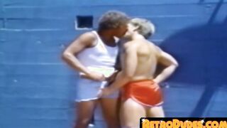 A traditional blowjob competition is taking place outside between young men