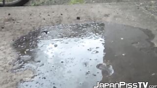 Tantalizing Japanese girl peeing in front of someone bicycle