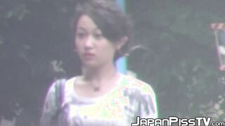 Tantalizing Japanese girl peeing in front of someone bicycle