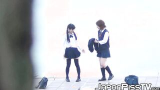Three Japanese schoolgirls pissing hard together in public