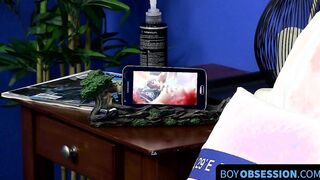 Cutie jerks off on the bed while holding a large dildo inside of him