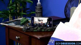 Cutie jerks off on the bed while holding a large dildo inside of him