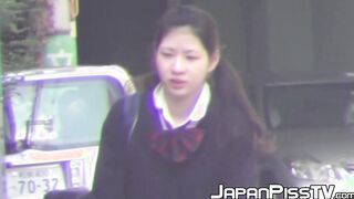 Delectable Japanese babe is peeing outside during day time