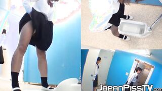Three wicked Japanese schoolgirls peeing together in toilet