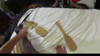 whole bunch of  paddles hitting fat ass