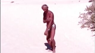 Tanned guy on beach in tiny string thong (temporarily!)
