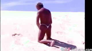 Tanned guy on beach in tiny string thong (temporarily!)
