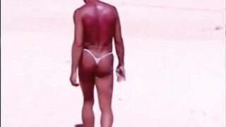 Tanned guy on beach in tiny string thong (temporarily!)