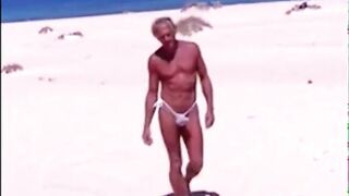Tanned guy on beach in tiny string thong (temporarily!)