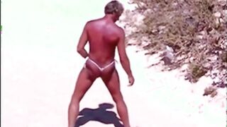 Tanned guy on beach in tiny string thong (temporarily!)
