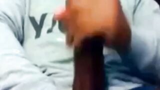 Hunk Strokes His Big Black Cock to Porn and Cums Twice