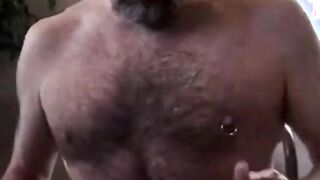 Hairy bear daddy strokes his meat