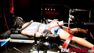 Chained jock Devin Franco lying face down being fisted in his ass