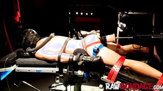 Chained jock Devin Franco lying face down being fisted in his ass