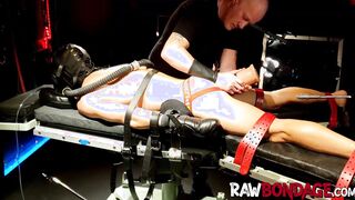 Chained jock Devin Franco lying face down being fisted in his ass