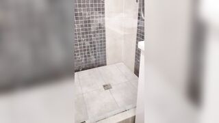 Blonde caught with a vibrator into the shower