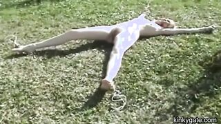 My blonde slut lying tied up on the lawn