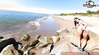 German vacationers having outdoors sex on the beach