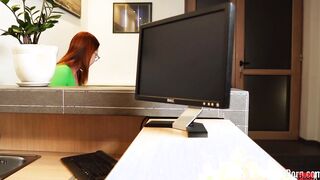 Fucking a red haired behind her working desk