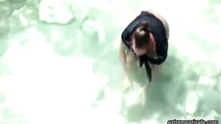 stepmother wades naked in the surf