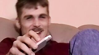 Moustached guy jerks off in his comfy couch
