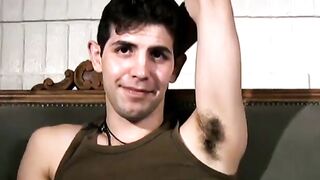 Slim twink tugs on his throbbing dick in this classic video
