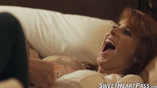 Redhead Penny Pax sat on the smooth face of Sovereign Syre in a wild tribbing session