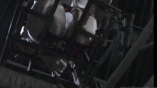 Caged sub anally impaled