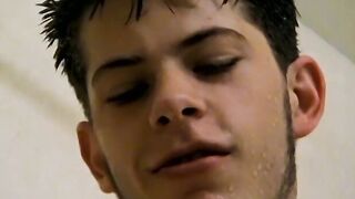 Sexy Bleu is blowing smoke and stroking his cock in the while taking a shower
