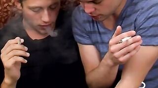 Two handsome twinks mess around the couch while smoking
