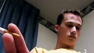 Cute chainsmoker stroke his cock as he blows smoke clouds