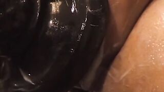 This deviant black stud fills his ass with the biggest dildo ever, stretching it like