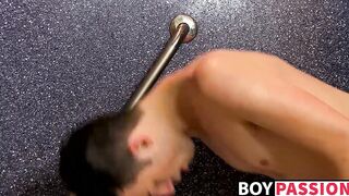 Gorgeous lad gets naked in the shower and rides a wall dildo