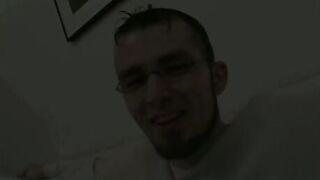 Twink wears sexy glasses while jerking off his thick cock
