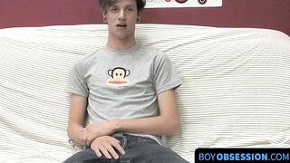 On a couch by himself cute gay man Danny jerks off his dick