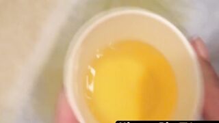 Japanese dollface tops a cup off with her pee and records it