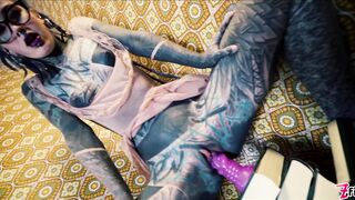 Inked babe Anuskatzz fucks both of her tight holes