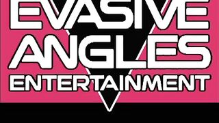 EVASIVE ANGLES He sits down on her couch while she