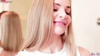 Lia Lennon stands still as her lover Fibi European helps her fondle her huge hair.