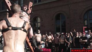 A crowd gathers to watch the brutal flogging