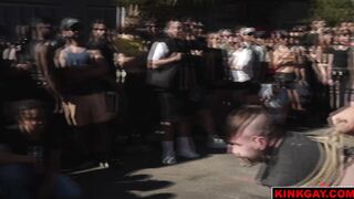 A crowd gathers to watch the brutal flogging
