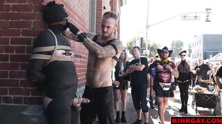 A crowd gathers to watch the brutal flogging